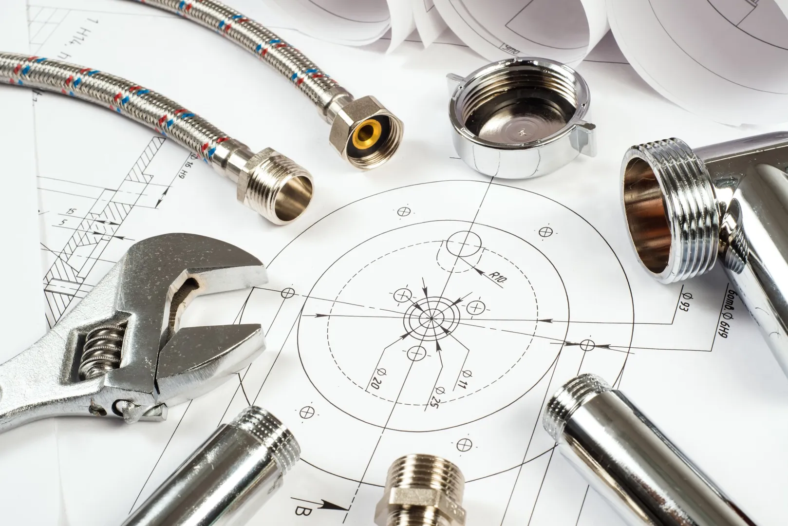 Plumbing tools on technical blueprint